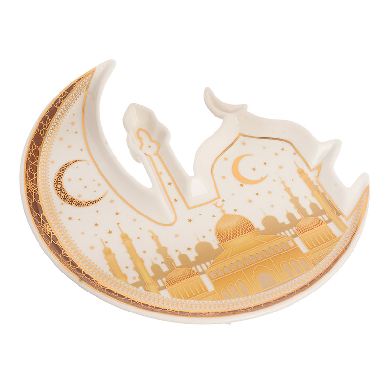 A three-dimensional porcelain plate in the shape of a crescent and a white and gold mosque