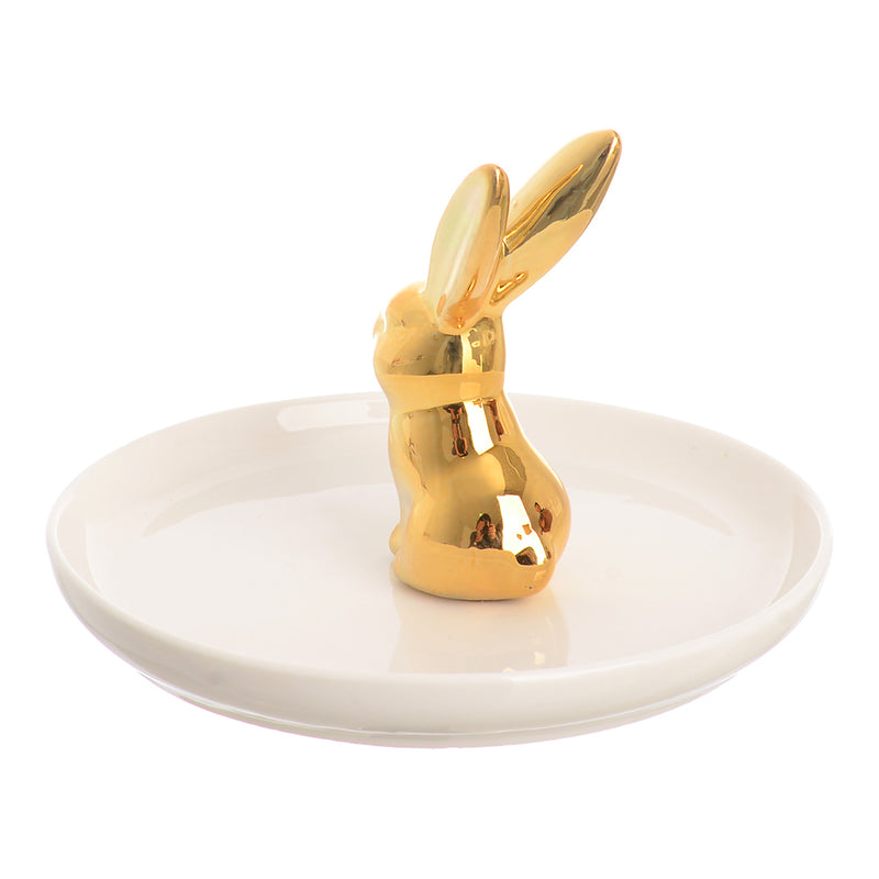 A circular ceramic dish with a rabbit-shaped ornament organizer in the middle, white and gold