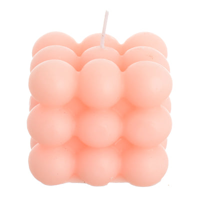 Scented wax cube, pink wax bubbles attached to the wrapper