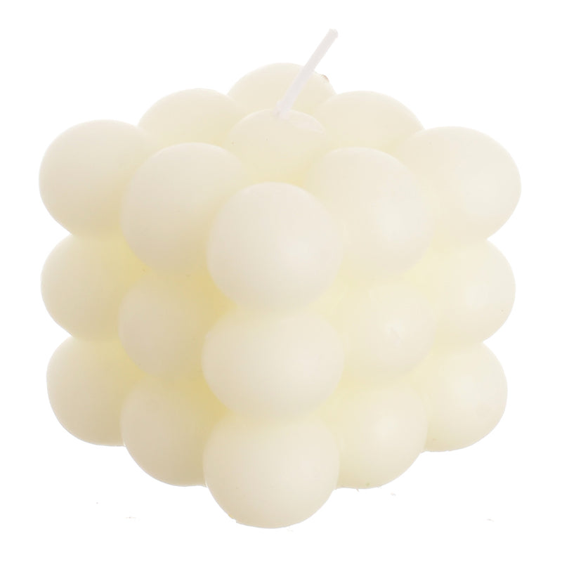 Scented candle with wax bubbles attached to the white wrapper