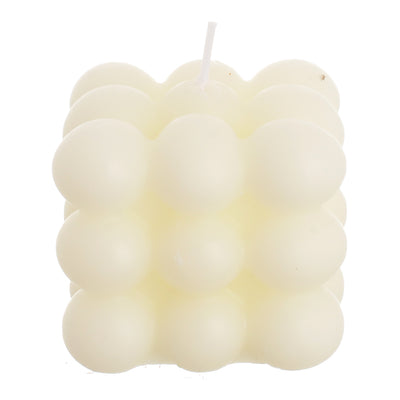 Scented candle with wax bubbles attached to the white wrapper