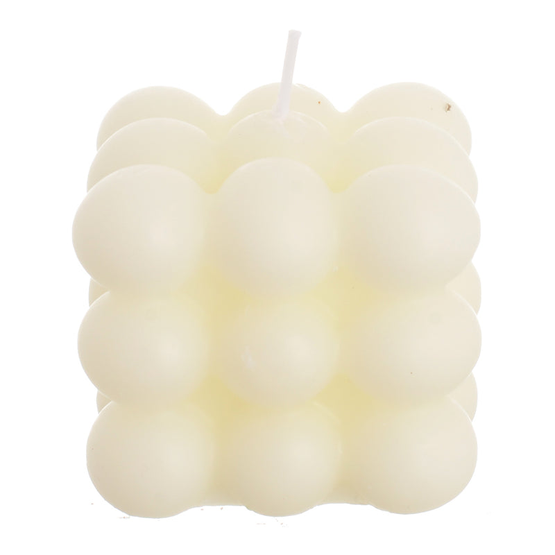 Scented candle with wax bubbles attached to the white wrapper