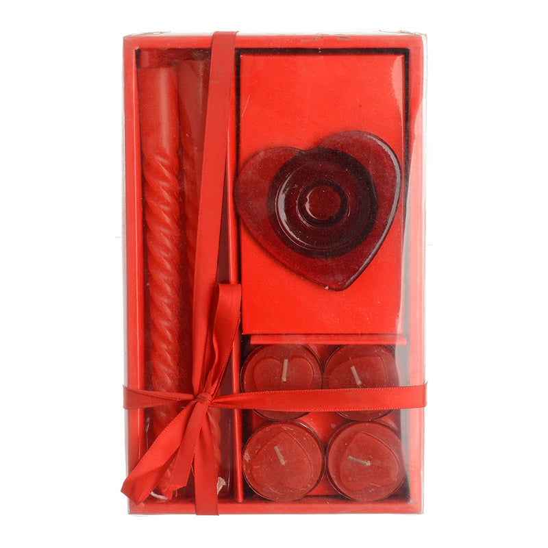 A box of scented candles of 6 pieces with a red glass candle holder