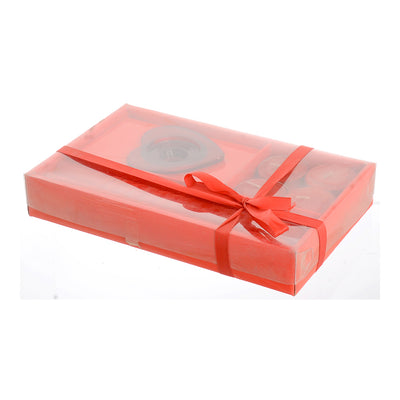 A box of scented candles of 6 pieces with a red glass candle holder